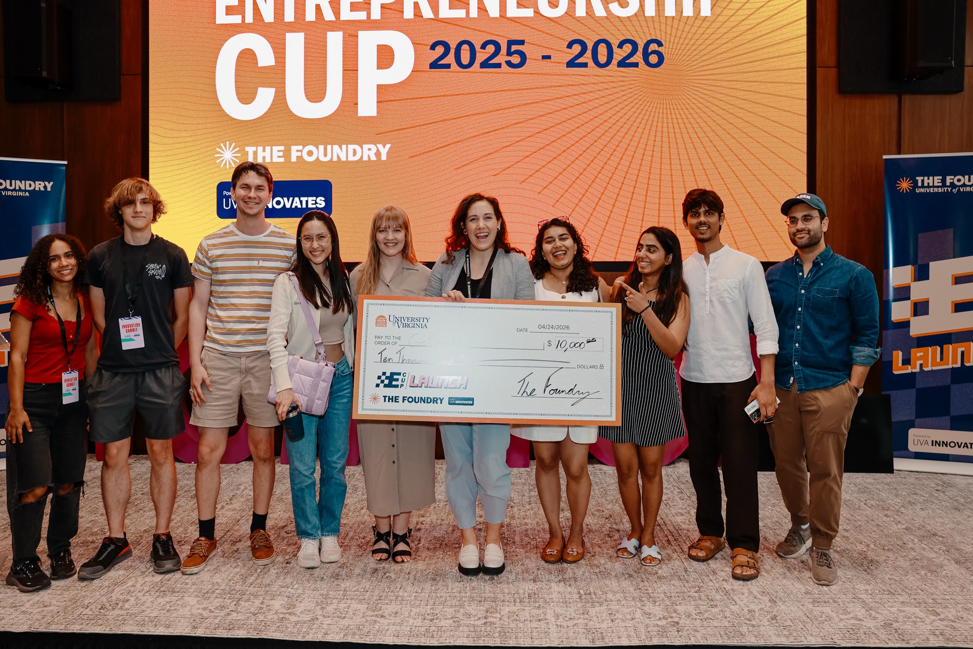 A team presenting on stage at the E-Cup 2026 finals